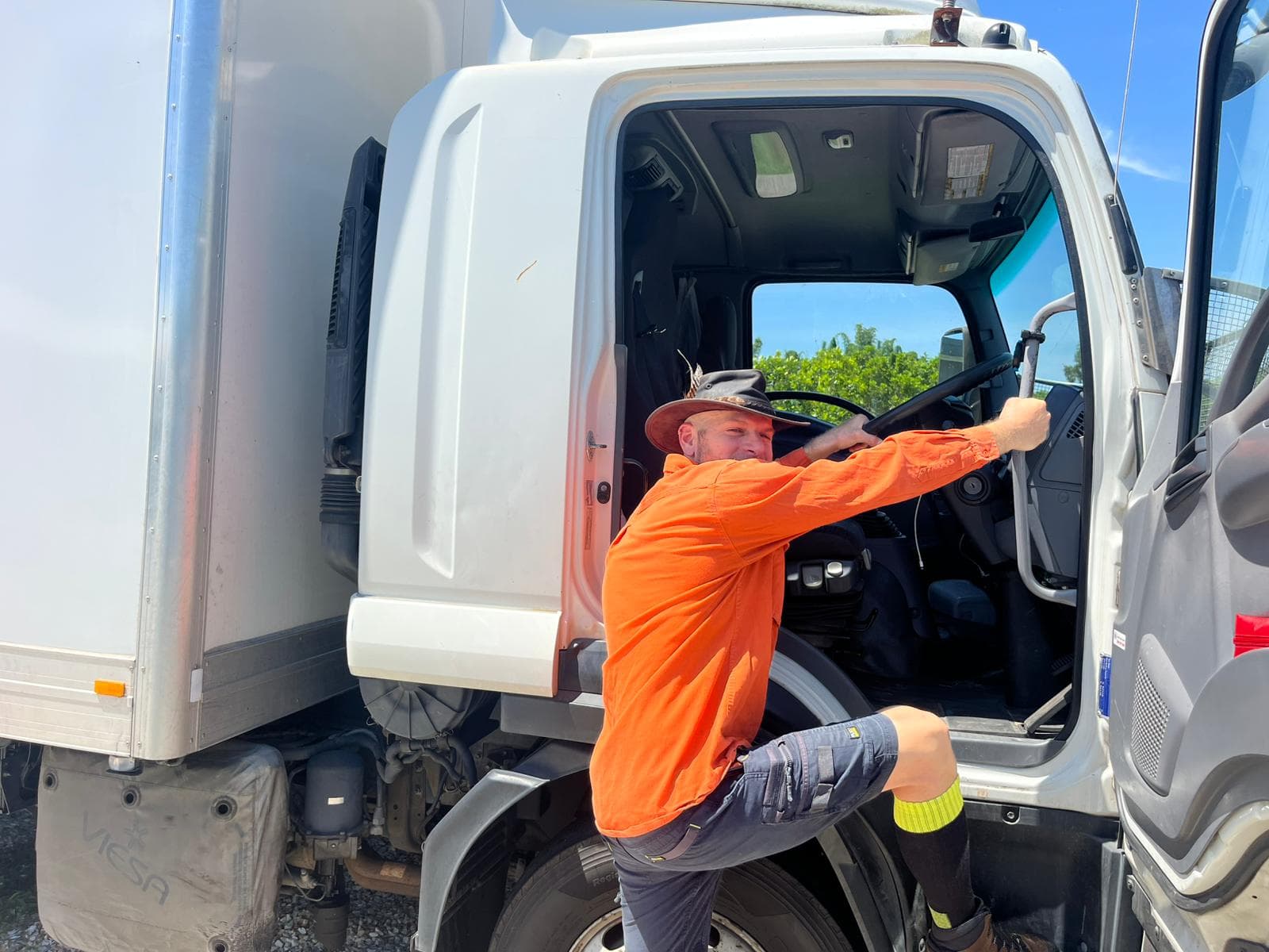 Ariel climbing into the cab of his Ready To Move truck