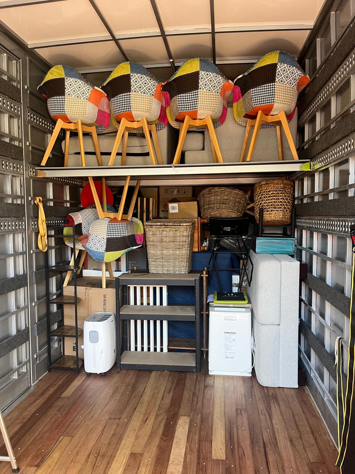 A Ready To Move truck packed tight with chairs, appliances and furniture